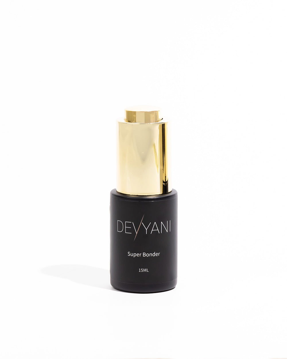 Black bottle with gold cap labeled 'DEVYANI' on a white background