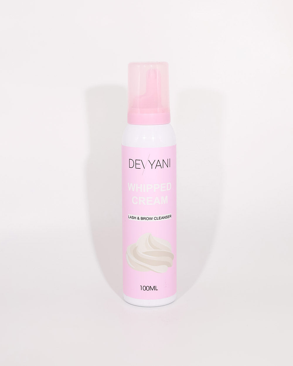 Devyani lash and brow cleanser bottle with pink label on a white background