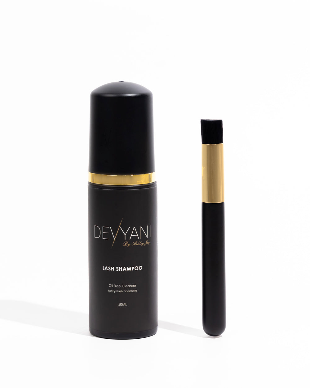 Devyani lash shampoo bottle with a brush on a white background