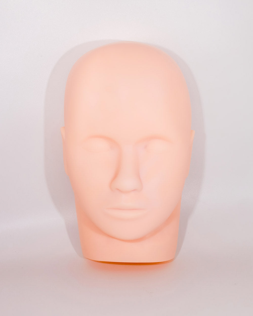 Mannequin head on a light gray background