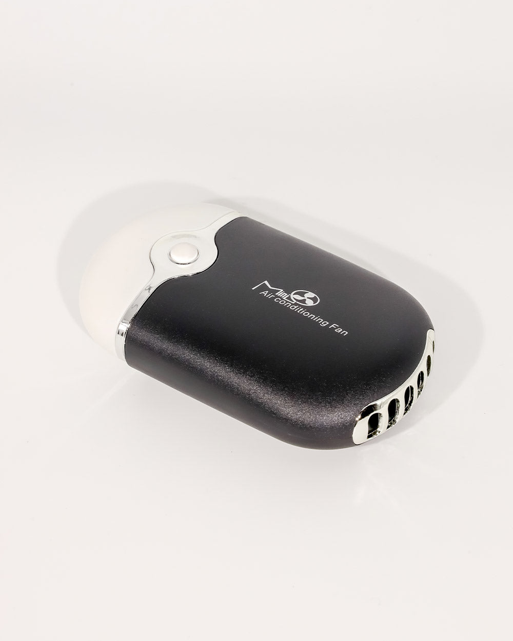 Black and silver air conditioning fan on a white background