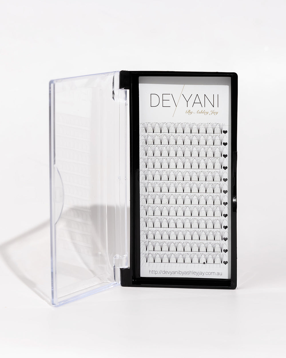 Devyani false eyelashes in a clear case on a white background