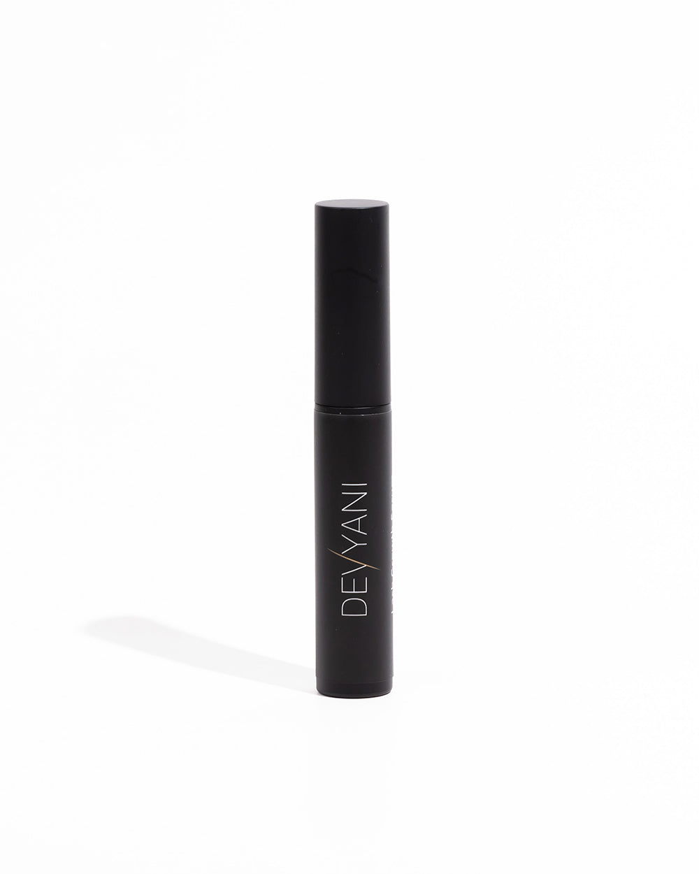 Black cylindrical product with 'DEVYANI branding on a white background