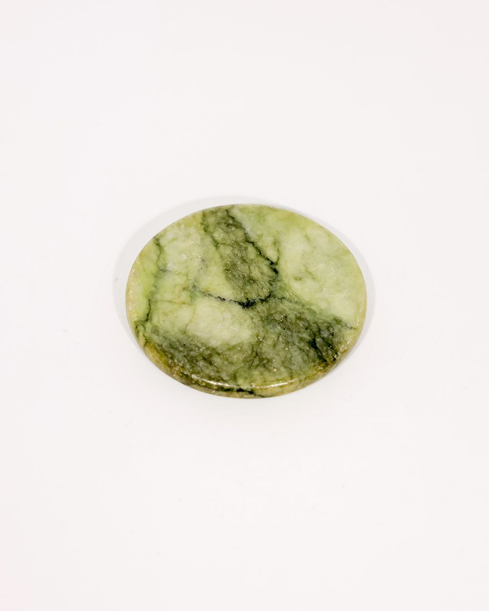 Green marbled stone on a white background